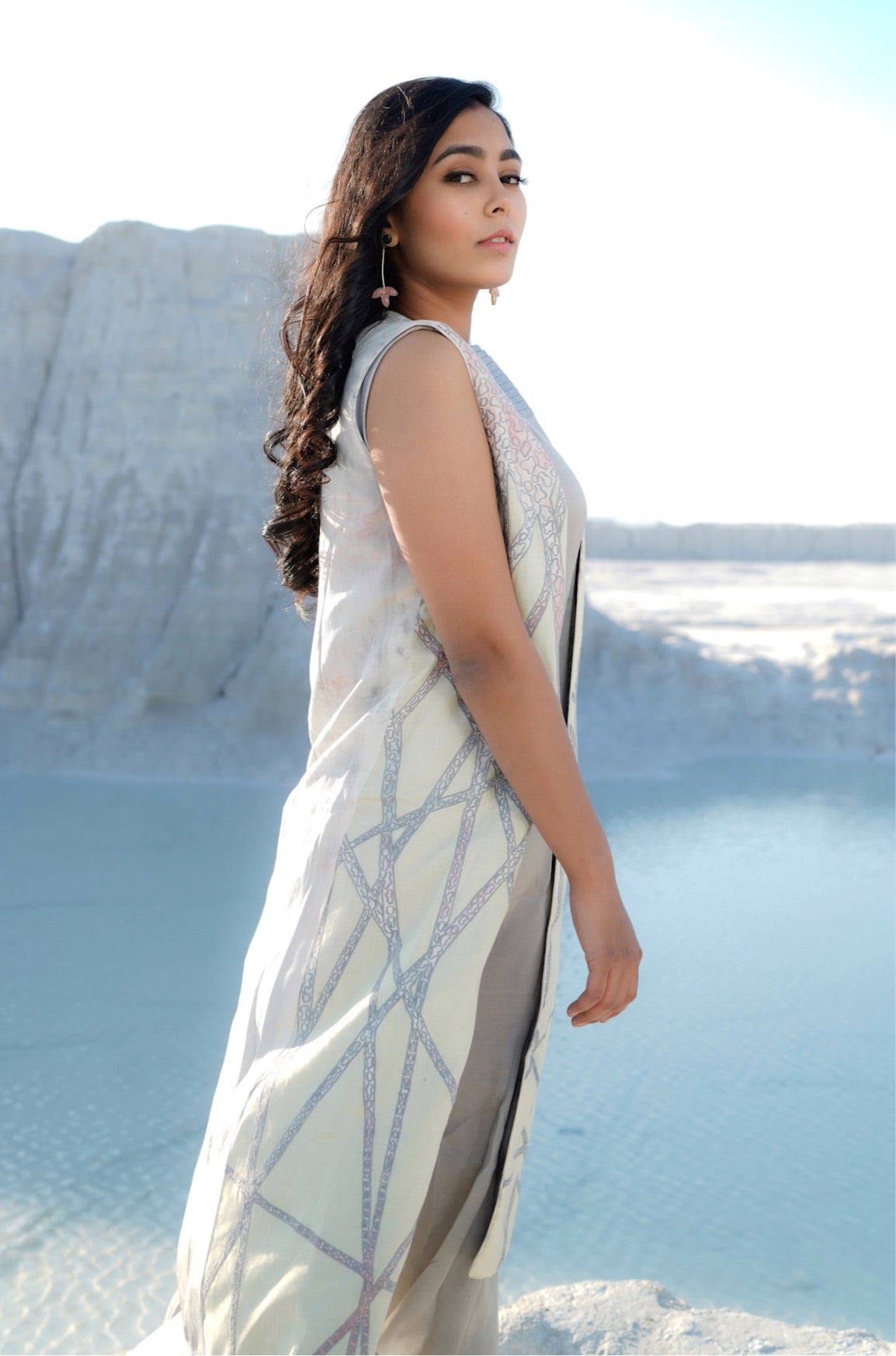 Grey dress with pleat details paired with sleeveless embroidered coal - Label Manasi
