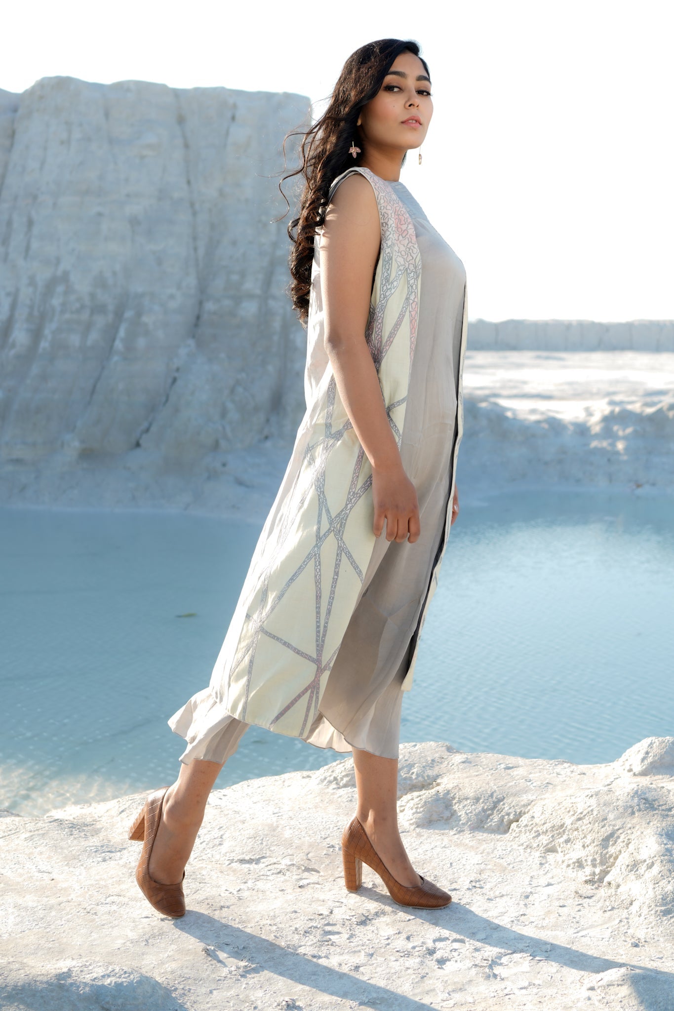 Grey dress with pleat details paired with sleeveless embroidered coal - Label Manasi
